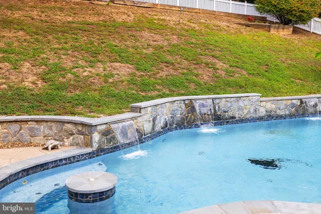 an aerial view of a pool yard patio and outdoor seating