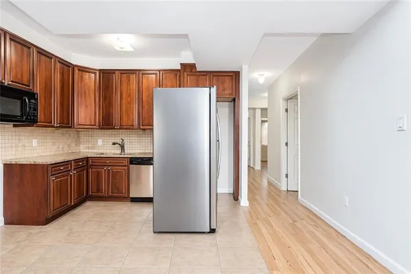 $939,000 | 8405 19th Avenue, Unit 1B | Van Pelt Manor
