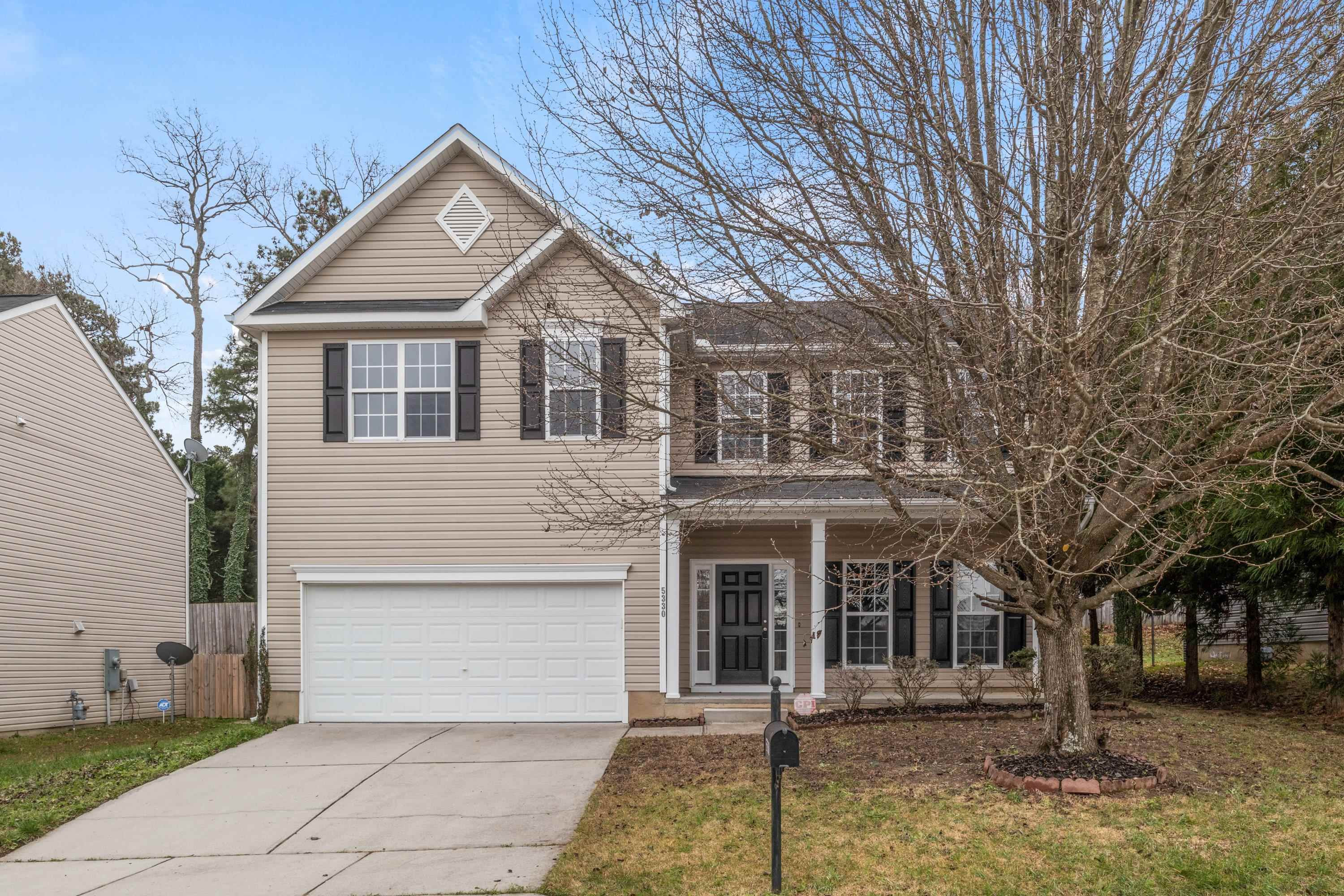 5330 Stowecroft Lane Raleigh, NC 27616 - Photo 3 of 46 a front view of a house with garage