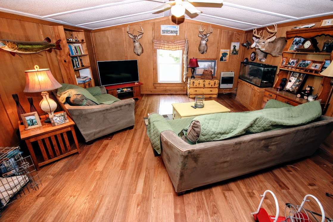 3671 Osborne Road Winnebago, IL 61088 - Photo 5 of 24 a living room with furniture and a flat screen tv