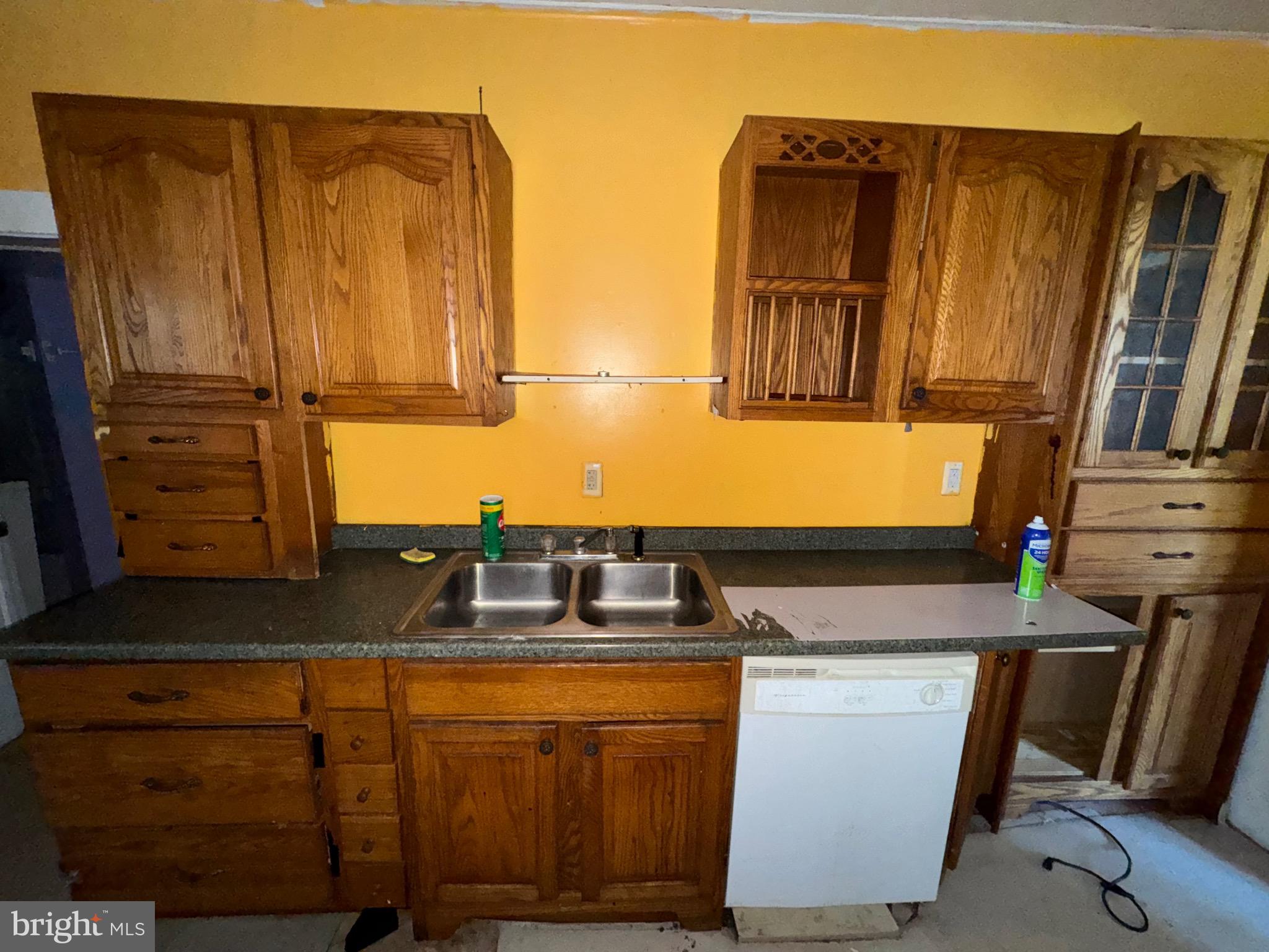 30432 Oak Street Princess Anne, MD 21853 - Photo 11 of 11 a kitchen with stainless steel appliances granite countertop a sink stove and cabinets