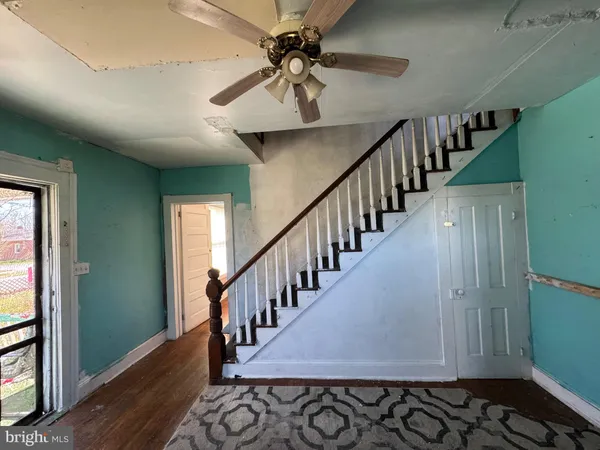 a view of entryway with wooden floor