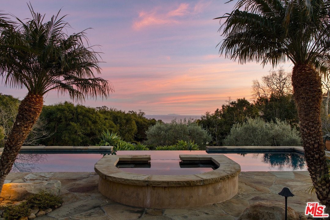 2838 East Valley Road Santa Barbara, CA 93108 - Photo 2 of 28 a view of a swimming pool with a yard