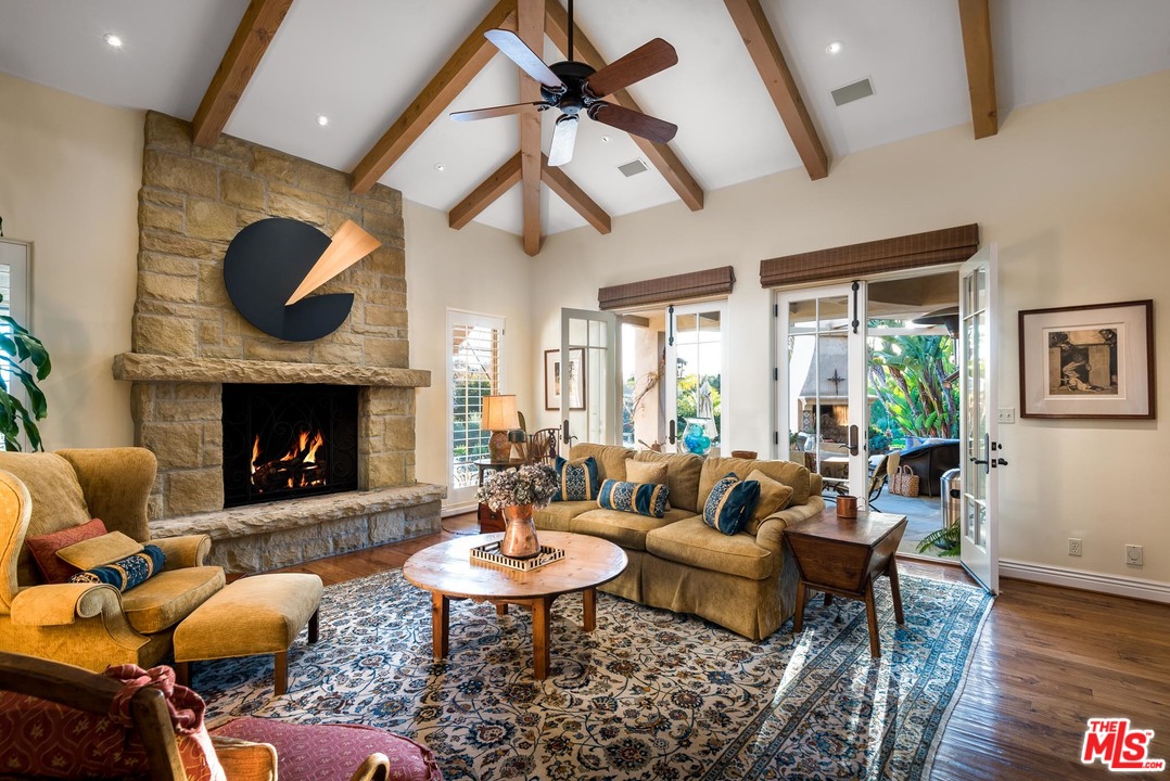 2838 East Valley Road Santa Barbara, CA 93108 - Photo 12 of 28 a living room with furniture a fireplace and a table