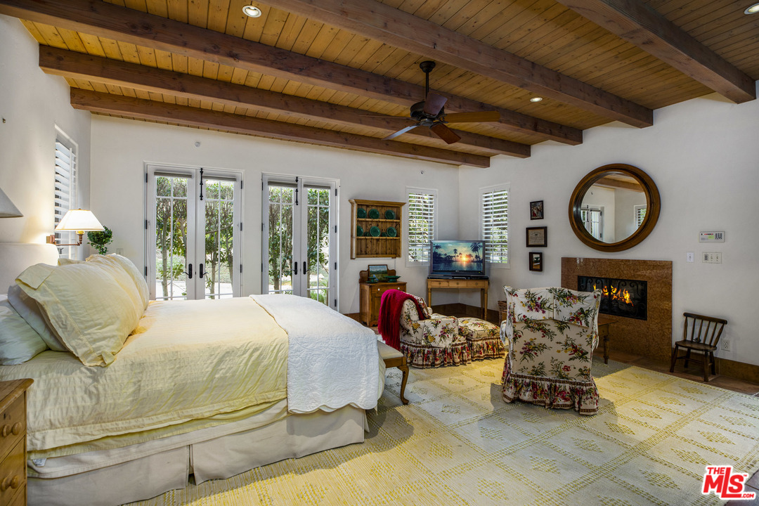 2838 East Valley Road Santa Barbara, CA 93108 - Photo 23 of 28 a bedroom with a bed window and a mirror