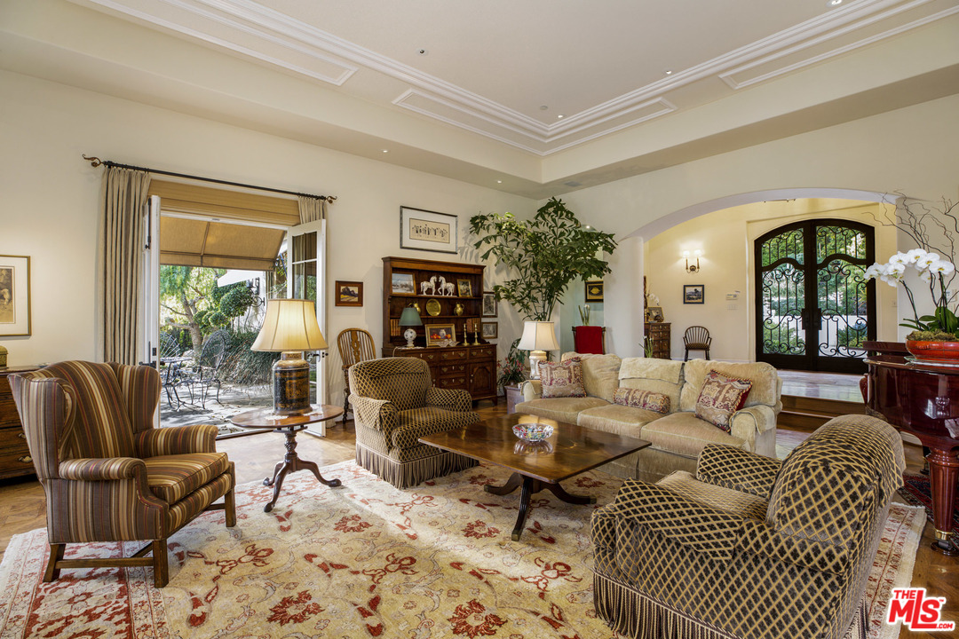 2838 East Valley Road Santa Barbara, CA 93108 - Photo 6 of 28 a living room with furniture potted plant and a large window