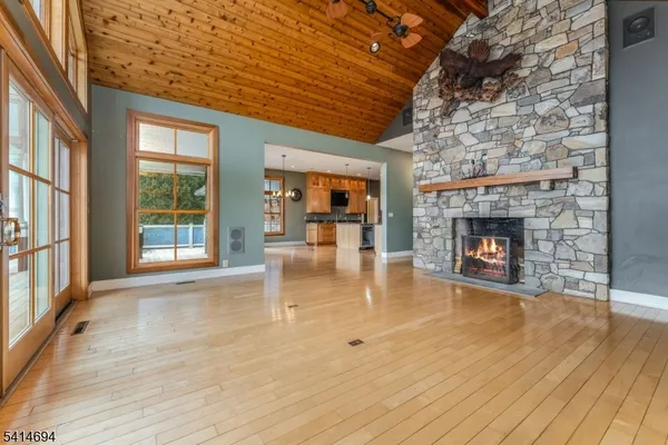 a view of an entryway with wooden floor