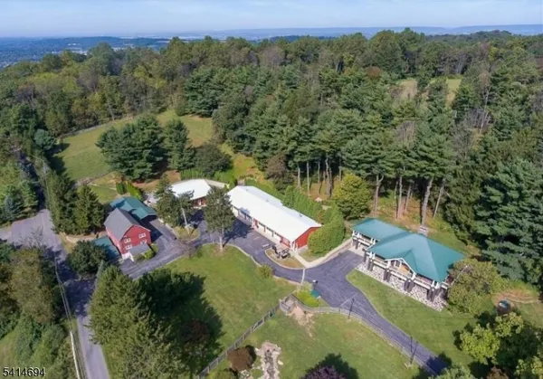an aerial view of house with yard