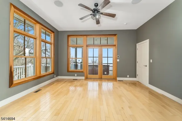 a large spacious bathroom with a tub sink shower and mirror