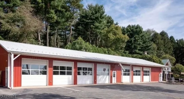 front view of a building with a garden