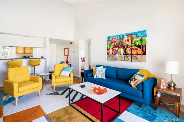 a living room with furniture and a lamp