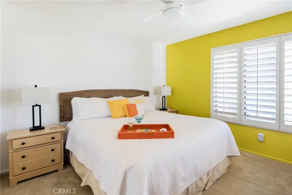 a bed room with a bed and a night stand