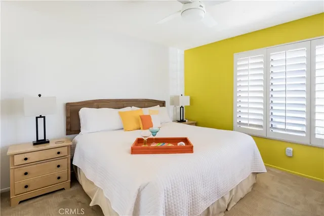 a bed room with a bed and a night stand