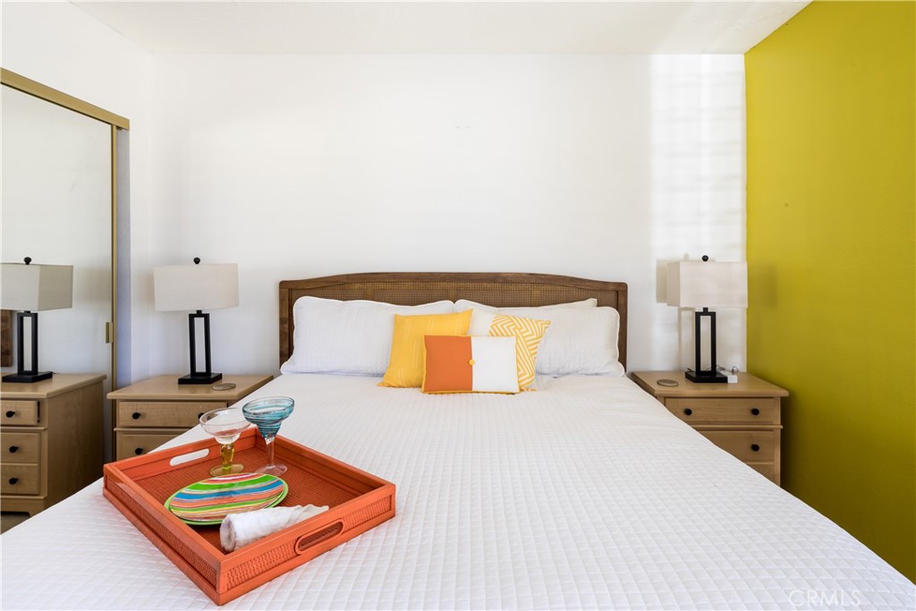 40657 Preston Trail Palm Desert, CA 92211 - Photo 13 of 46 a bed room with a bed and a night stand