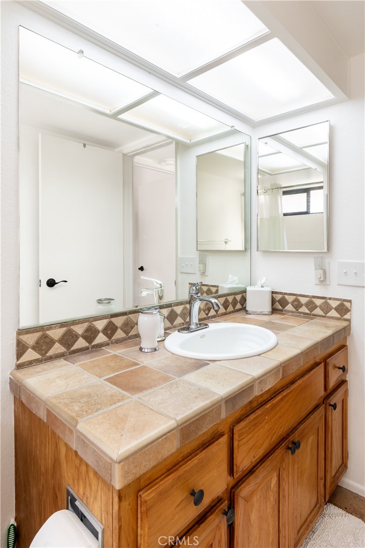 40657 Preston Trail Palm Desert, CA 92211 - Photo 14 of 46 a bathroom with a sink and a mirror