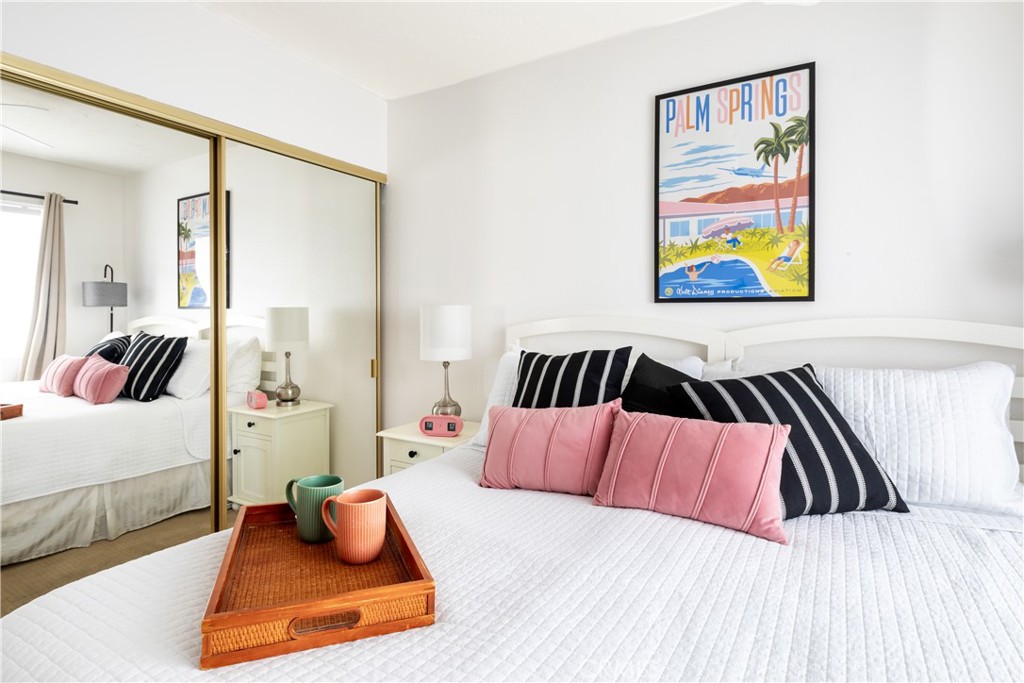 40657 Preston Trail Palm Desert, CA 92211 - Photo 15 of 46 a bedroom with a bed and cupboard