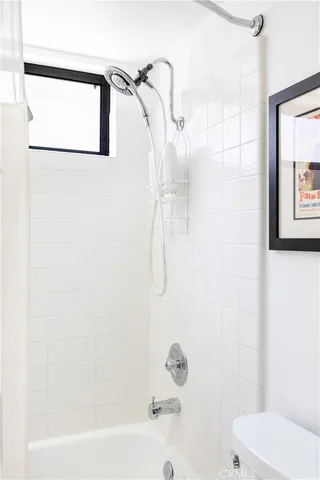 a kitchen with stainless steel appliances granite countertop a sink a stove and refrigerator