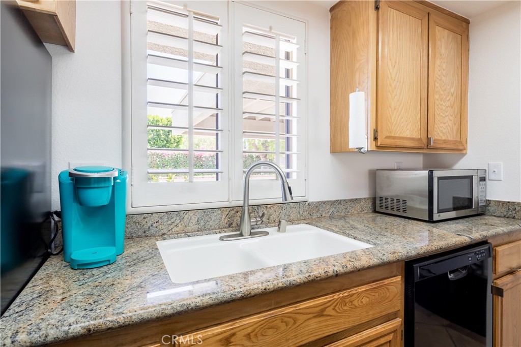 40657 Preston Trail Palm Desert, CA 92211 - Photo 24 of 46 a kitchen with sink and window
