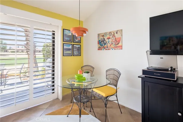 a living room with furniture and flat screen tv