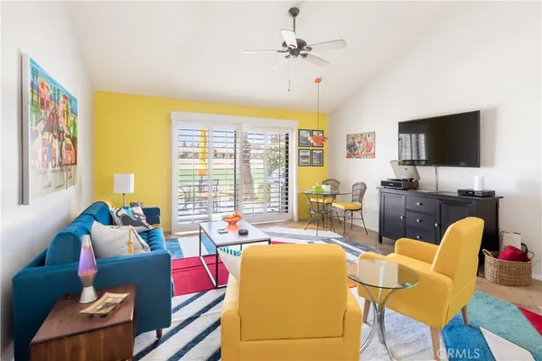 a kitchen with stainless steel appliances kitchen island granite countertop a table and chairs