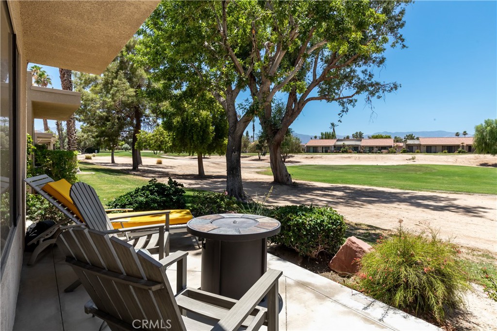 40657 Preston Trail Palm Desert, CA 92211 - Photo 42 of 46 a view of a patio with chairs and a yard