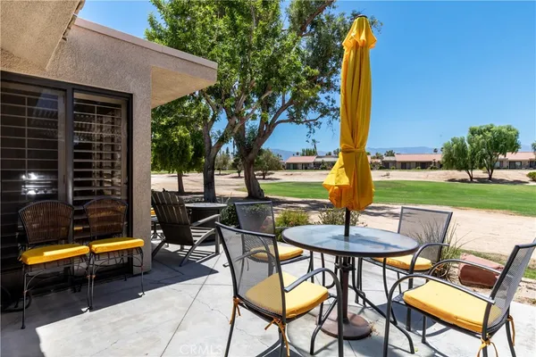 a view of a patio with swimming pool