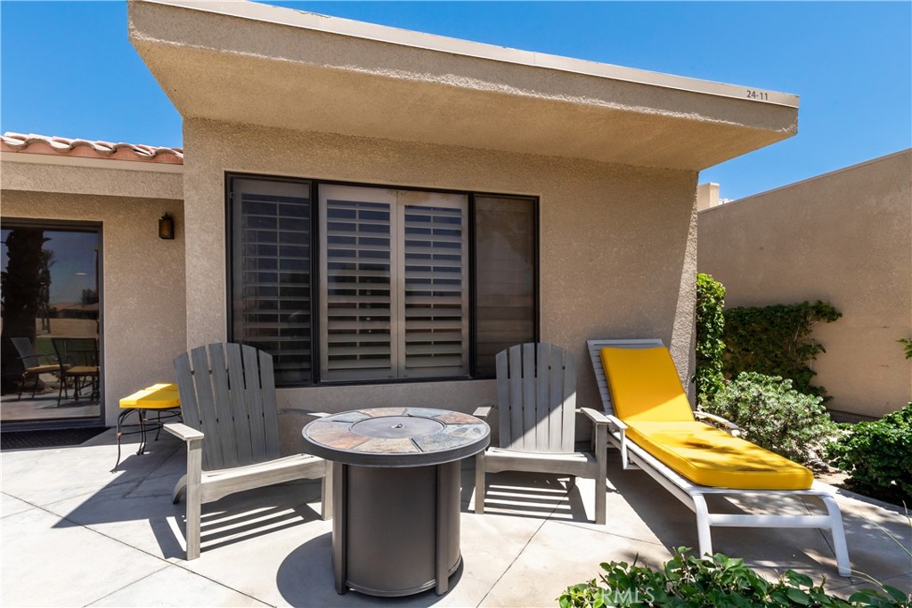 40657 Preston Trail Palm Desert, CA 92211 - Photo 45 of 46 a view of a patio with swimming pool