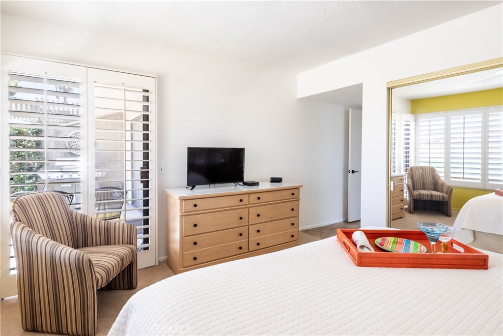 40657 Preston Trail Palm Desert, CA 92211 - Photo 7 of 46 a bedroom with furniture and a flat screen tv