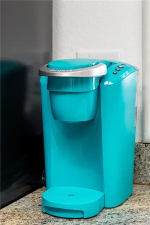 a bedroom with furniture and a large window