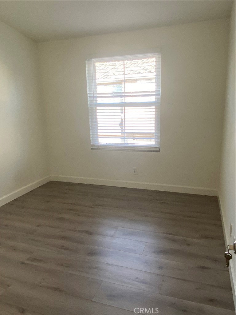 3301 Orangewood Irvine, CA 92618 - Photo 7 of 10 wooden floor in an empty room with a window