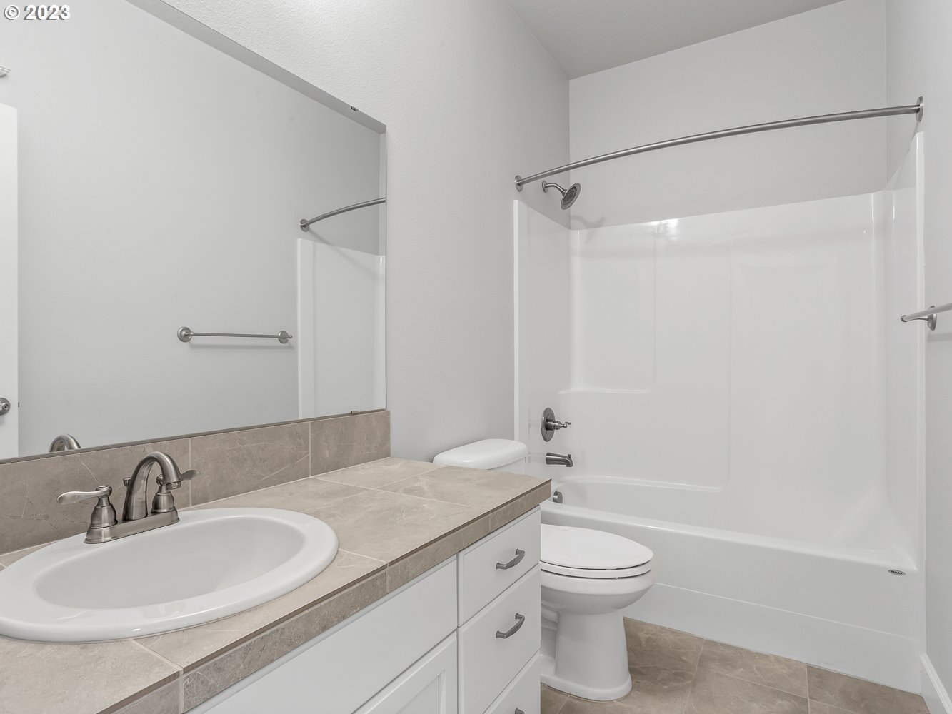 1826 South 46th Place Ridgefield, WA 98642 - Photo 9 of 48 a bathroom with a granite countertop sink toilet and shower