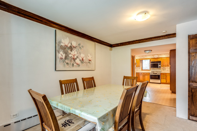 191 Lawton Road Riverside, IL 60546 - Photo 7 of 25 a dining room with furniture and wooden floor