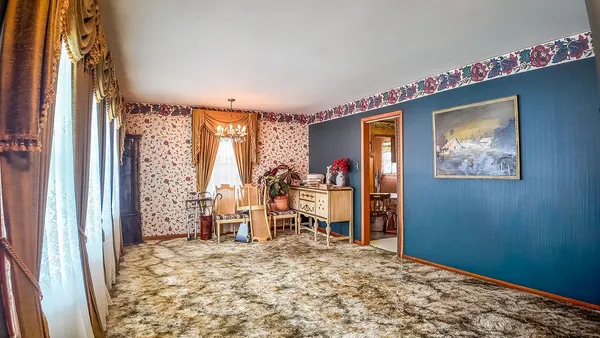 a kitchen with a stove a sink and a wooden cabinets