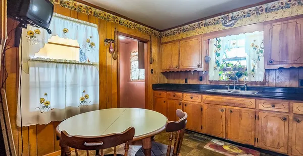 a kitchen with stainless steel appliances granite countertop a coffee maker on top of it