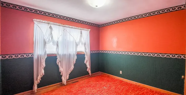 a bedroom with a bed and a mirror
