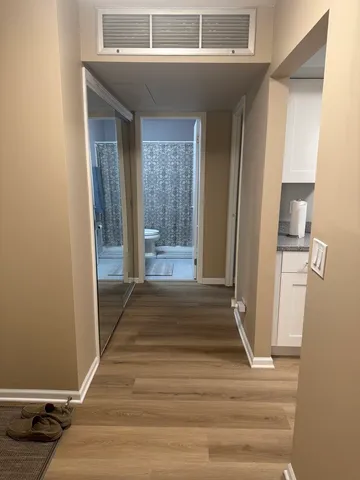 a view of a room that has a bed in it