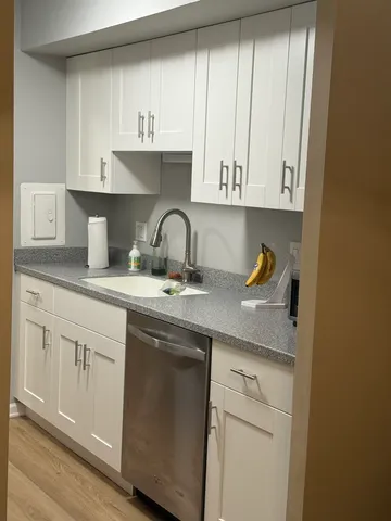 a kitchen with appliances cabinets and a counter top space