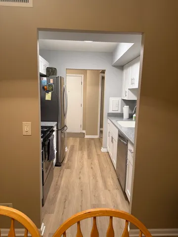 a view of a kitchen from the main door