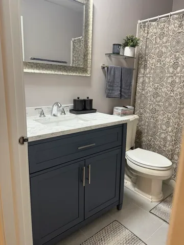 a bedroom with a bed and a couch