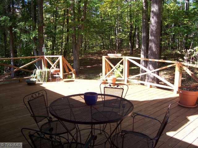 251 Lakeview Road Mocksville, NC 27028 - Photo 13 of 15 Patio/Deck. Large private deck looks out into peaceful wooded backyard. Can be accessed from the great room or office.