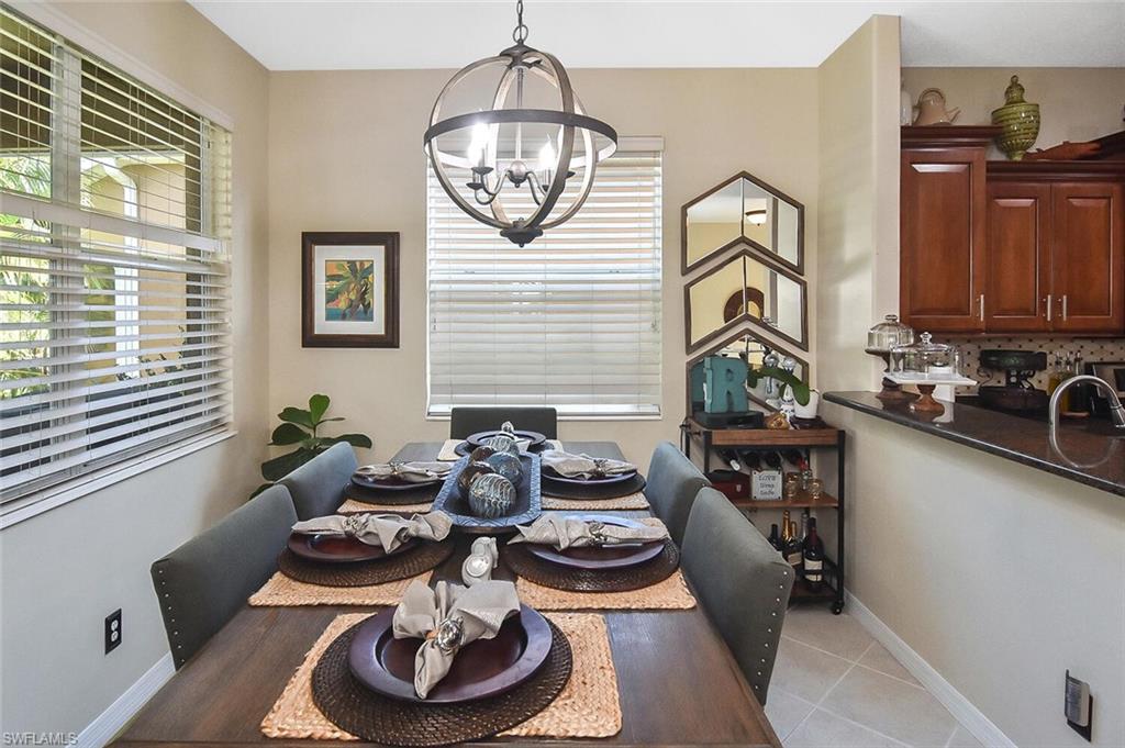 12421 Rock Ridge Lane Fort Myers, FL 33913 - Photo 15 of 50 a table and chairs in a kitchen