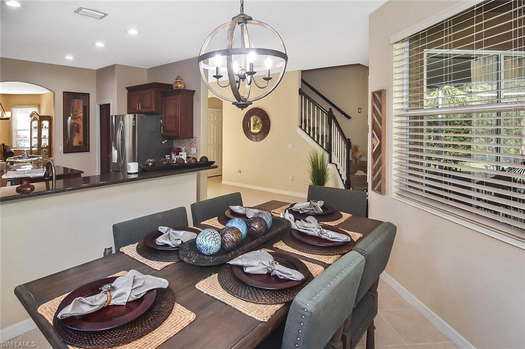 12421 Rock Ridge Lane Fort Myers, FL 33913 - Photo 16 of 50 a table and chairs in a dining room