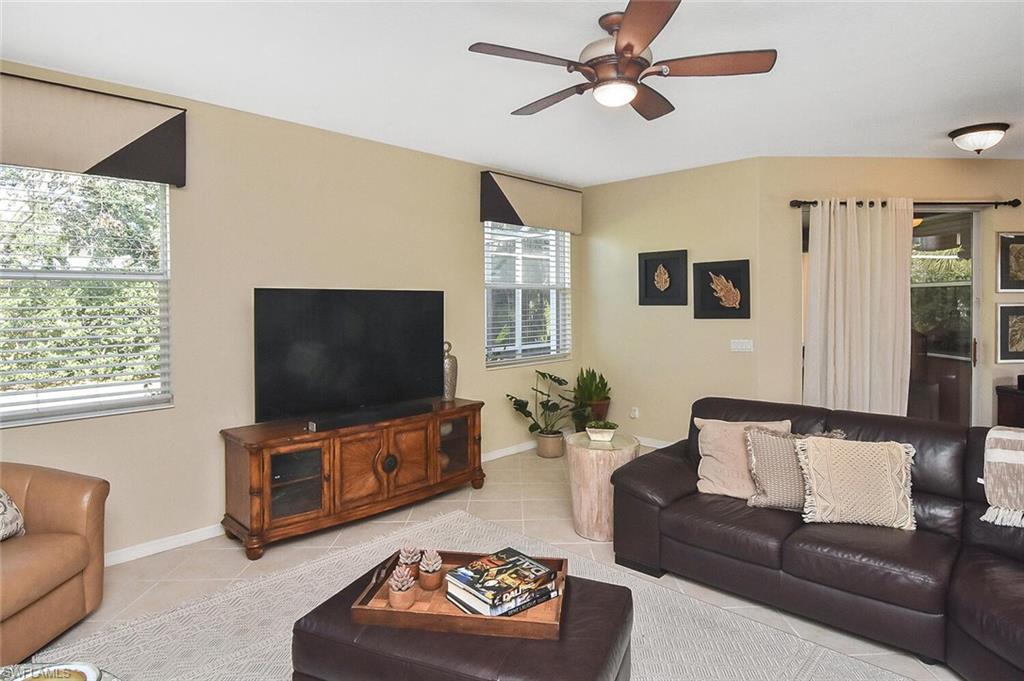 12421 Rock Ridge Lane Fort Myers, FL 33913 - Photo 19 of 50 a living room with furniture and a flat screen tv