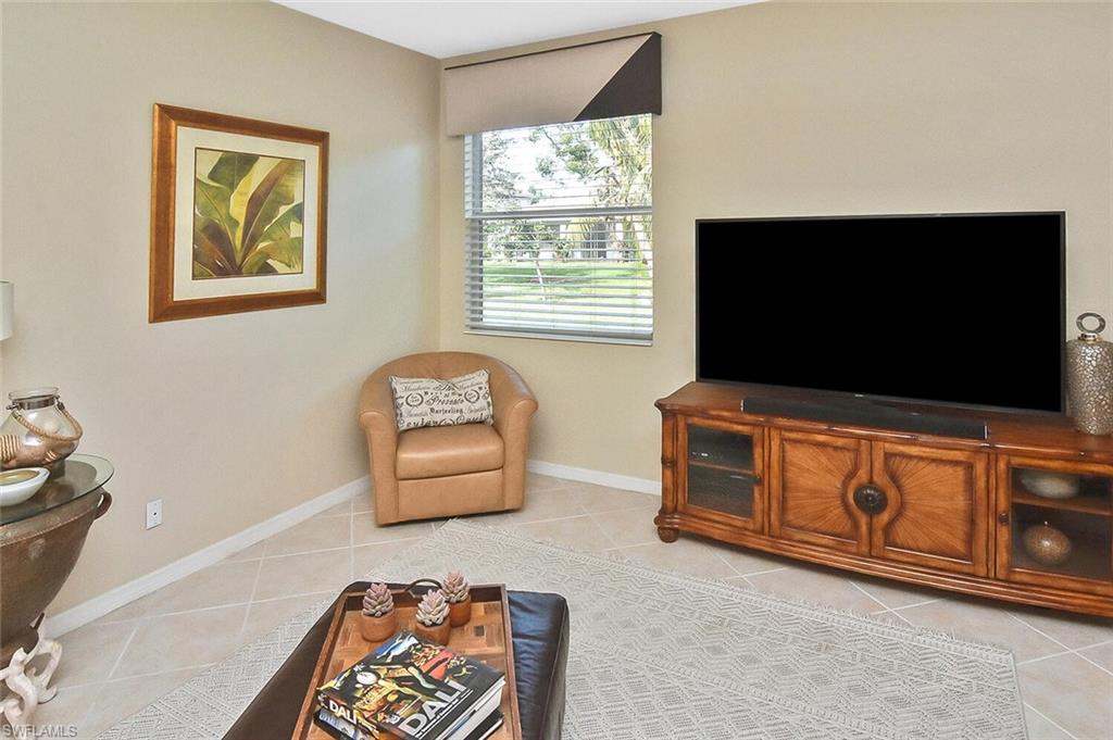 12421 Rock Ridge Lane Fort Myers, FL 33913 - Photo 20 of 50 a living room with furniture and a flat screen tv