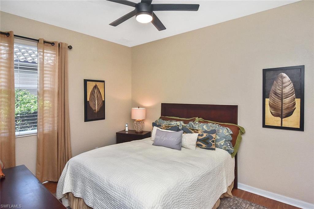 12421 Rock Ridge Lane Fort Myers, FL 33913 - Photo 27 of 50 a bedroom with bed and wooden floor