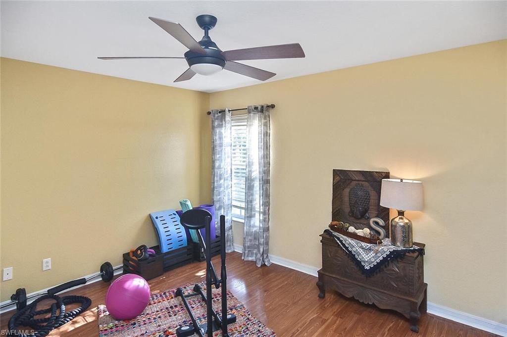 12421 Rock Ridge Lane Fort Myers, FL 33913 - Photo 31 of 50 a living room with furniture and a window