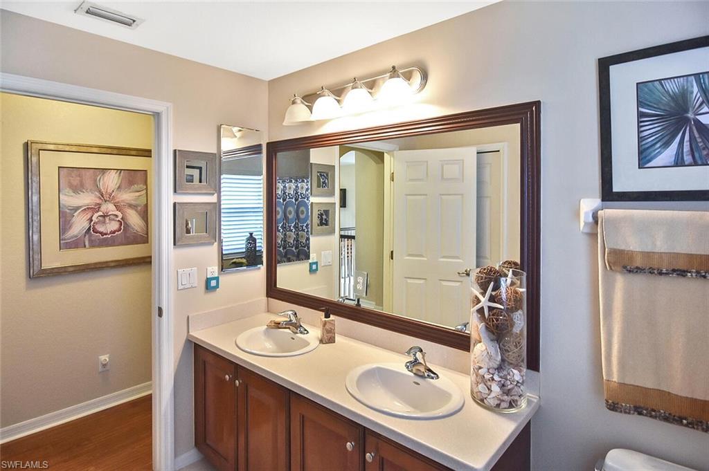 12421 Rock Ridge Lane Fort Myers, FL 33913 - Photo 33 of 50 a bathroom with a sink and a mirror