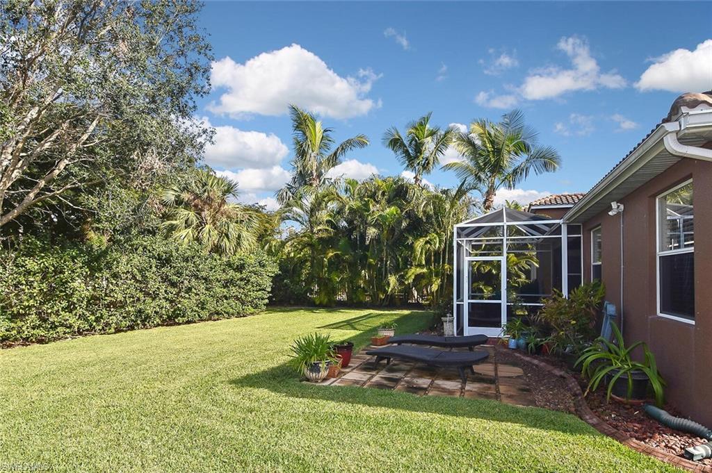 12421 Rock Ridge Lane Fort Myers, FL 33913 - Photo 39 of 50 a view of a house with a yard and a fountain
