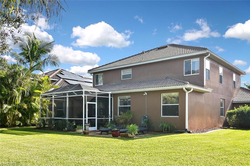 12421 Rock Ridge Lane Fort Myers, FL 33913 - Photo 40 of 50 a front view of a house with garden