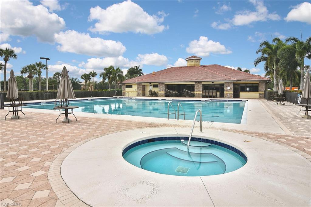 12421 Rock Ridge Lane Fort Myers, FL 33913 - Photo 43 of 50 a swimming pool with outdoor seating and barbeque oven
